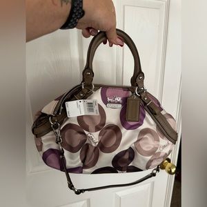 Coach purple hand bag never used still has tags on it